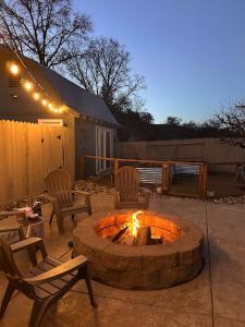 a fire pit in a yard with chairs and lights at Pool, Sauna, Spa, & Fire-pit in Ukiah +64 photos