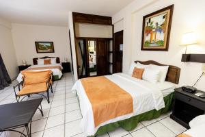 Cama o camas de una habitación en Hotel Camino Maya
