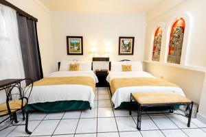 Cama o camas de una habitación en Hotel Camino Maya