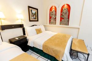 Cama o camas de una habitación en Hotel Camino Maya