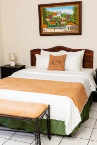 Postel nebo postele na pokoji v ubytování Hotel Camino Maya