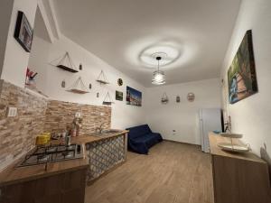 a kitchen with a sink and a stove at Sonalerba Ammare Trabia H H in Trabia