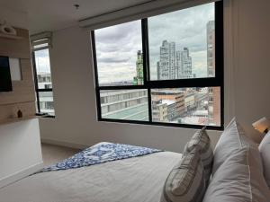 Voodi või voodid majutusasutuse Hermosa Vista en Chapinero cómodo wifi toas