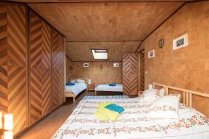 Cama o camas de una habitación en Refúgio da Vila Santiago