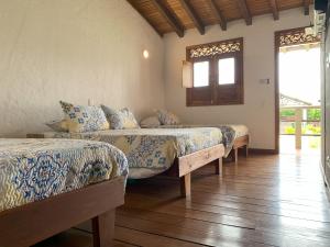 Postel nebo postele na pokoji v ubytování Casa Santa Rita - Tres Habitaciones
