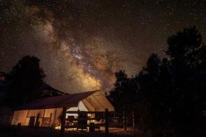 a barn at night with the milky way at Glamping Tent #9 with AC and Private Bath 2 Queens in Orderville +12 photos