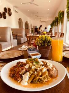 a plate of food on a table with a plate of food at Hotel Costa Bugambilias in Manzanillo +15 photos