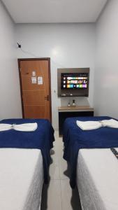 Postel nebo postele na pokoji v ubytování Pousada e Lofts Marabá Quarto 4