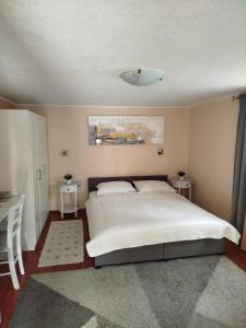 Postel nebo postele na pokoji v ubytování Apartman Tihana