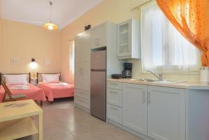 Postel nebo postele na pokoji v ubytování Aggelis Villa