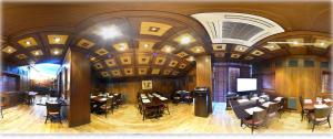 a room with tables and chairs in a restaurant at فندق أميري سويت in Umm Uthainah