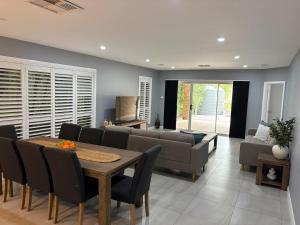a living room with a couch and a table at The Goldsmith Retreat in Goulburn