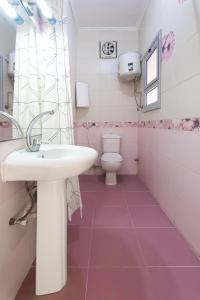 a bathroom with a sink and a toilet at Studio 1Bed Room Apartment in Hurghada +16 photos