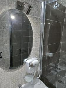 a bathroom with a shower and a toilet and a mirror at Le spighe dei papi in Anagni