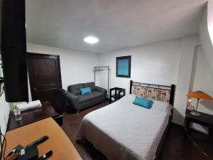 Ένα ή περισσότερα κρεβάτια σε δωμάτιο στο Casa Miranda Airport