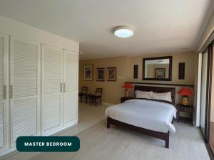 Postel nebo postele na pokoji v ubytování Coralpoint Gardens Suites & Residences