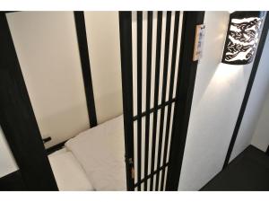 Postel nebo postele na pokoji v ubytování Yadoya