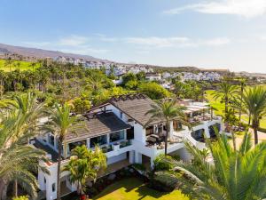 an aerial view of a house with palm trees at Las Terrazas de Abama Suites in Guía de Isora