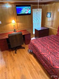 TV a/nebo společenská místnost v ubytování Homestay