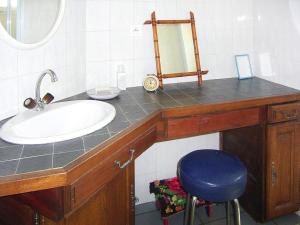 a bathroom with a sink and a mirror at Holiday Home in Piriac near Sandy Beach in Piriac-sur-Mer +20 photos