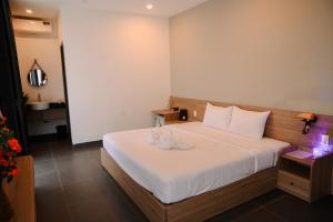 Ein Bett oder Betten in einem Zimmer der Unterkunft Charm House Hue