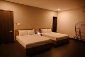 Ein Bett oder Betten in einem Zimmer der Unterkunft Charm House Hue