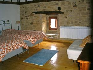 Llit o llits en una habitació de Don Baldomero Hotel Rural