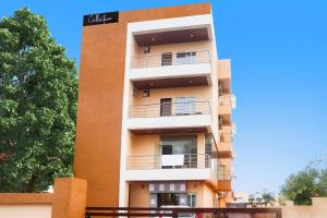 a tall building with balconies on the side of it at Hotel O The villa in Bhopal +33 photos