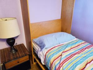 Postel nebo postele na pokoji v ubytování Yonegan Central Maui Getaways