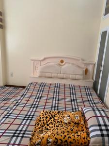 a room with a bed with a leopard print mattress at Hữu Đặng in Chau Doc
