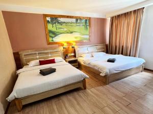 Postel nebo postele na pokoji v ubytování Hotel Balik Pulau