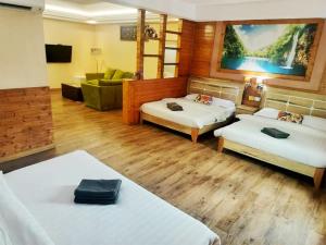 Postel nebo postele na pokoji v ubytování Hotel Balik Pulau