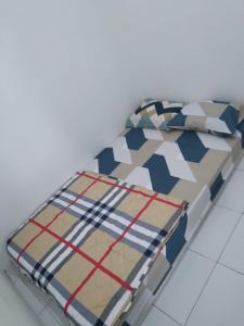 Ένα ή περισσότερα κρεβάτια σε δωμάτιο στο Penginapan Permata Syariah Wonosobo +13 φωτογραφίες