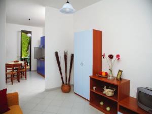 a living room with a couch and a tv at Residence in Sicily near Himera & Madonie Park in Buonfornello