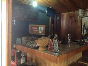 a bar in a restaurant with a counter with a counter at Alpha 3 Eco Cabin in Rantepao
