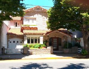 a house on the side of a street at Hotel Medina y Mar BnB in Mar del Plata
