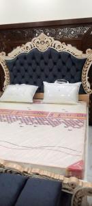 En eller flere senge i et værelse på Vacation Homes