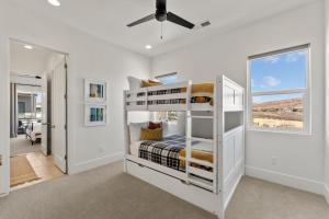 a bedroom with a bunk bed and a window at Villa #15 at Bloomington Country Club Dog-Friendly townhouse in St. George