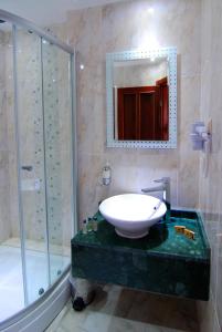 a bathroom with a tub, toilet and sink at White Garden Hotel-Adult Only in Antalya