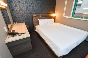 Postel nebo postele na pokoji v ubytování Sanco Inn Nagoya - Shinkansenguchi + 32 fotografií