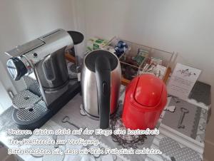 a kitchen counter with a coffee maker and a mixer at Gasthaus Meinradsberg in Einsiedeln