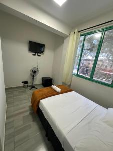 Postel nebo postele na pokoji v ubytování HOTEL PUERTO DULCE - La Virginia