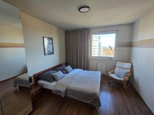 a bedroom with a bed and a window at Horyzont in Gdańsk +75 photos
