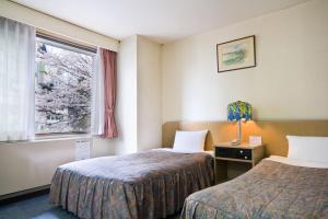 Postel nebo postele na pokoji v ubytování Hotel Luna Park + 37 fotografií