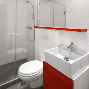 a bathroom with a toilet and a sink and a shower at Downtown Belgrade Apartments - CHERRY in Belgrade