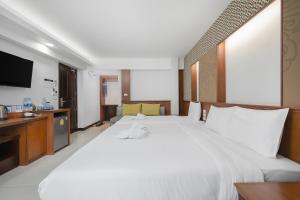 Postel nebo postele na pokoji v ubytování Cozytel Chiangmai