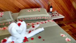 Cama ou camas em um quarto em Pousada Recanto das Águas