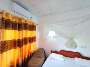 Postel nebo postele na pokoji v ubytování Bloom Guest House