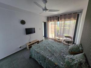 Ένα ή περισσότερα κρεβάτια σε δωμάτιο στο Les Aubépines 2