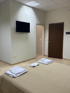 a room with a bed with two towels on it at Al Convento Bed & Breakfast Vasto Marina in Vasto